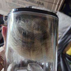 Dust cup full of fur after a session, photo from lita’s review